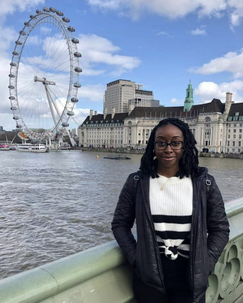 Woman Traveling The World. Woman Standing Near The London Eye Attraction Found in London, UK. Weekend Travel In London. Immersive Experiences In London.