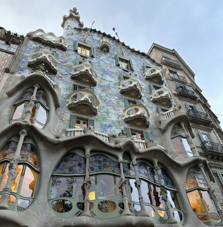 Photo of Casa Batllo in Barcelona Spain a main tourist attraction. Blue building resembling the ocean. One of the tourist attractions in Barcelona. Solo Trip To Barcelona.