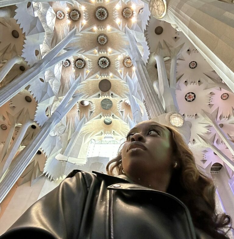 Woman Solo Travel in Barcelona. Woman inside La Sagrada Familia church in Barcelona Spain. Solo Trip To Barcelona.