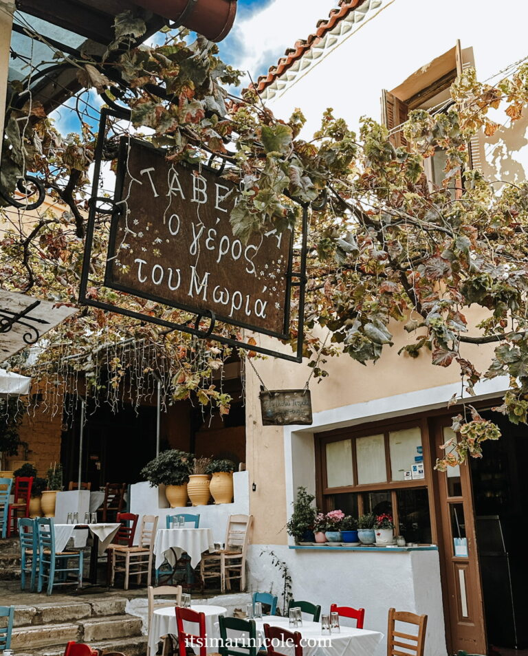 View of Greek Restaurant in Athens With Chairs On A Hill