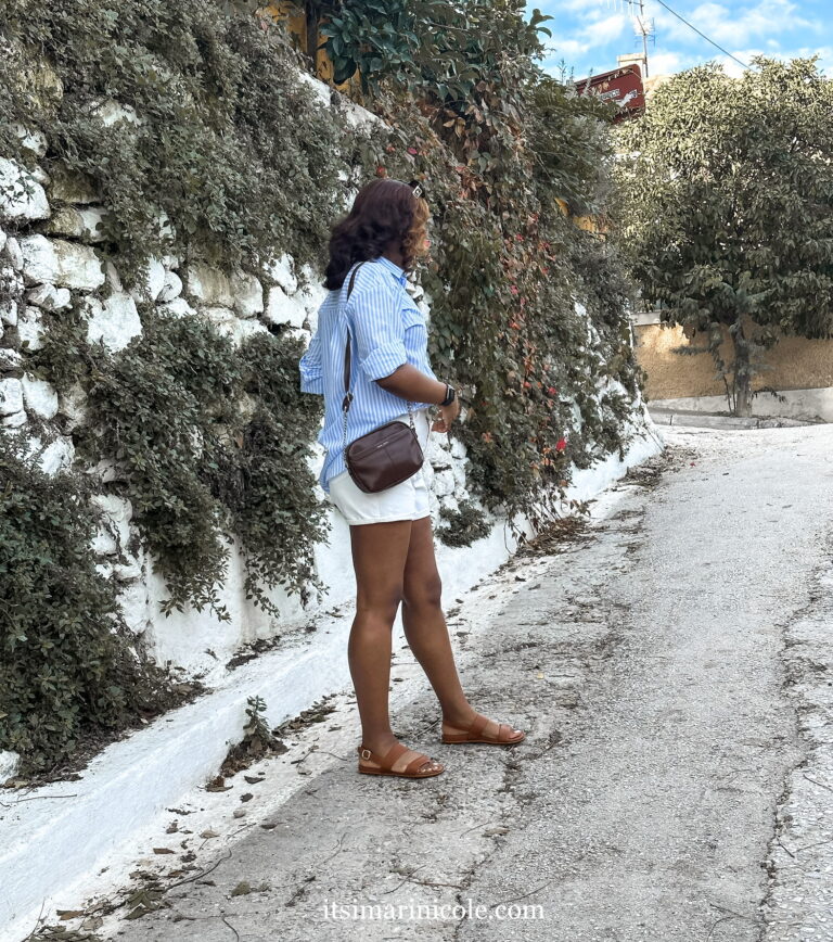 Woman white and blue outfit in Greece with natural fibers and FitFlop Gracie Sandals.